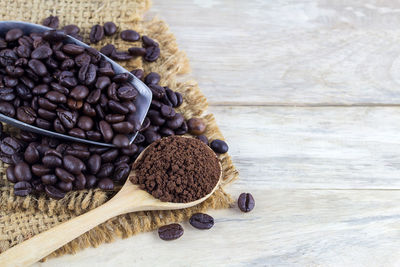 Close-up of roasted coffee beans on table