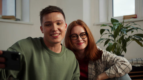 Young couple doing video call on smart phone