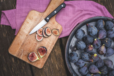 Top view of fresh figs on wooden board