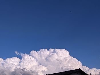 Low angle view of snow against sky