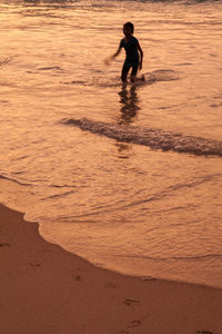 Kid playing in sea