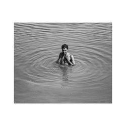 Portrait of a woman swimming in lake