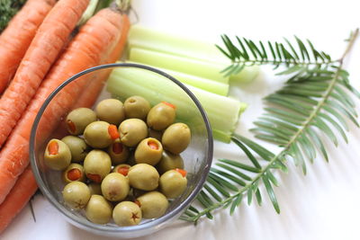 High angle view of vegetables with dip in bowl