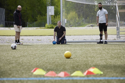 Men participating in sports competition in sports field