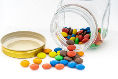 Close-up of multi colored candies in glass container