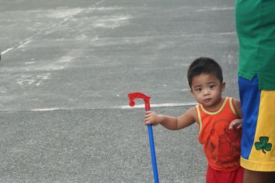View of boy holding toy