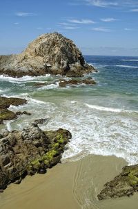 Scenic view of beach against sky