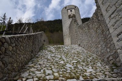 View of old ruin building against cloudy sky
