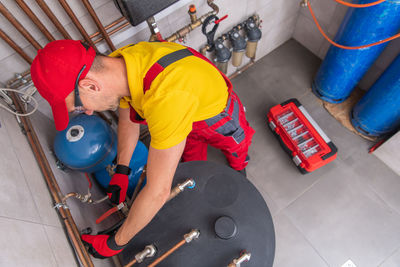 High angle view of man working at workshop