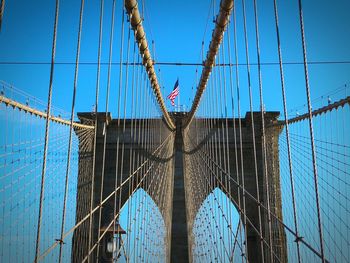 Low angle view of bridge against blue sky