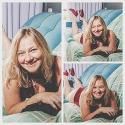 Portrait of smiling young woman lying on bed