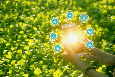 Digital composite image of hand holding smart phone