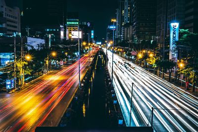 High angle view of light trails on road at night