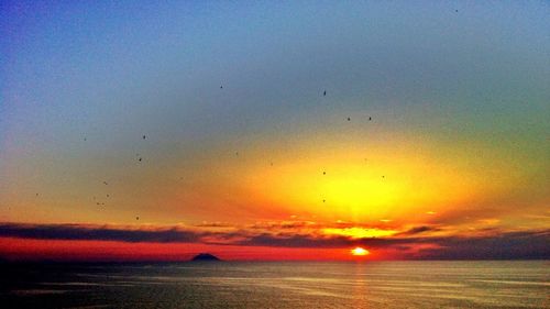 Scenic view of sea at sunset