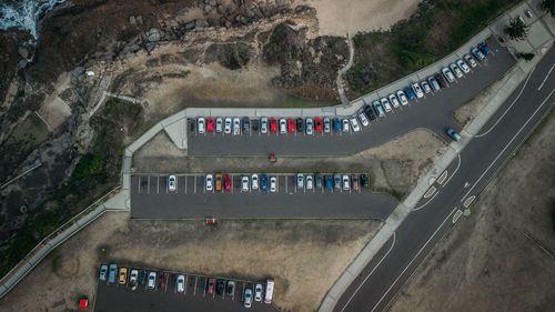 Aerial view of cars parked on road