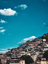Buildings in city against sky