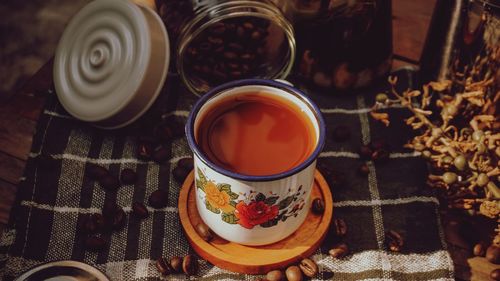 High angle view of milk coffee served on table