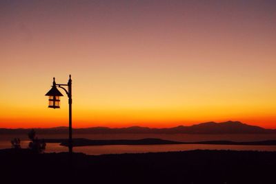 Scenic view of sunset over mountains