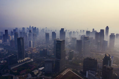 High angle view of buildings in city against sky