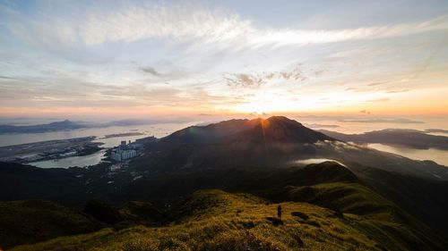 Scenic view of mountains against sky at sunset