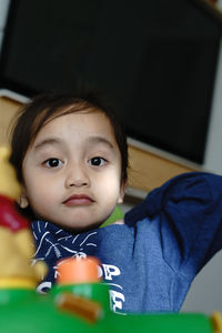 Portrait of cute baby girl at home