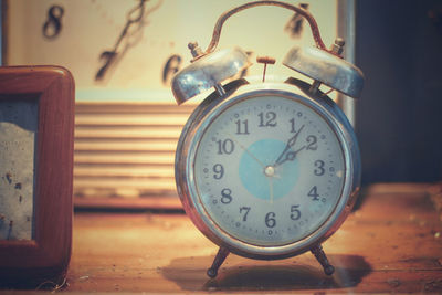 Close-up of clock on table