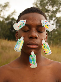 Close-up of boy blowing bubbles