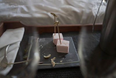 High angle view of desert on table between glasses