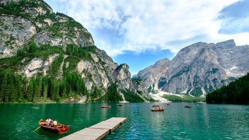 Scenic view of lake and mountains against sky