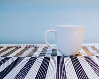 Close-up of coffee cup on table