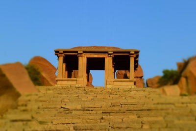 Low angle view of old temple against clear sky