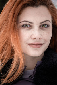 Close-up portrait of a smiling young woman