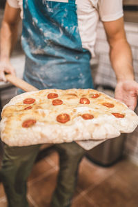 Midsection of man preparing food