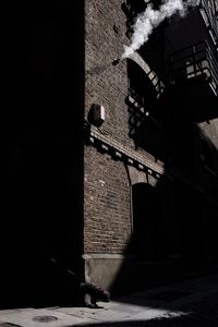 Alley amidst buildings in city