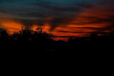 Silhouette landscape against scenic sky