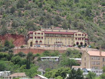 High angle view of buildings and trees in city