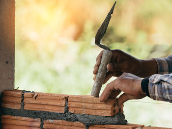 Close-up of man working on wood