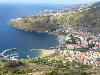 High angle view of city by sea