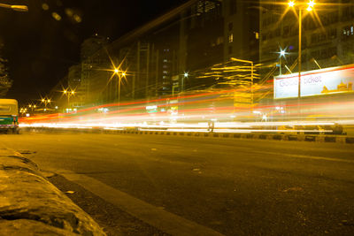 Light trails on street in city at night