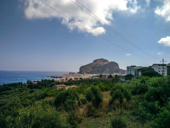 Scenic view of green landscape against sky