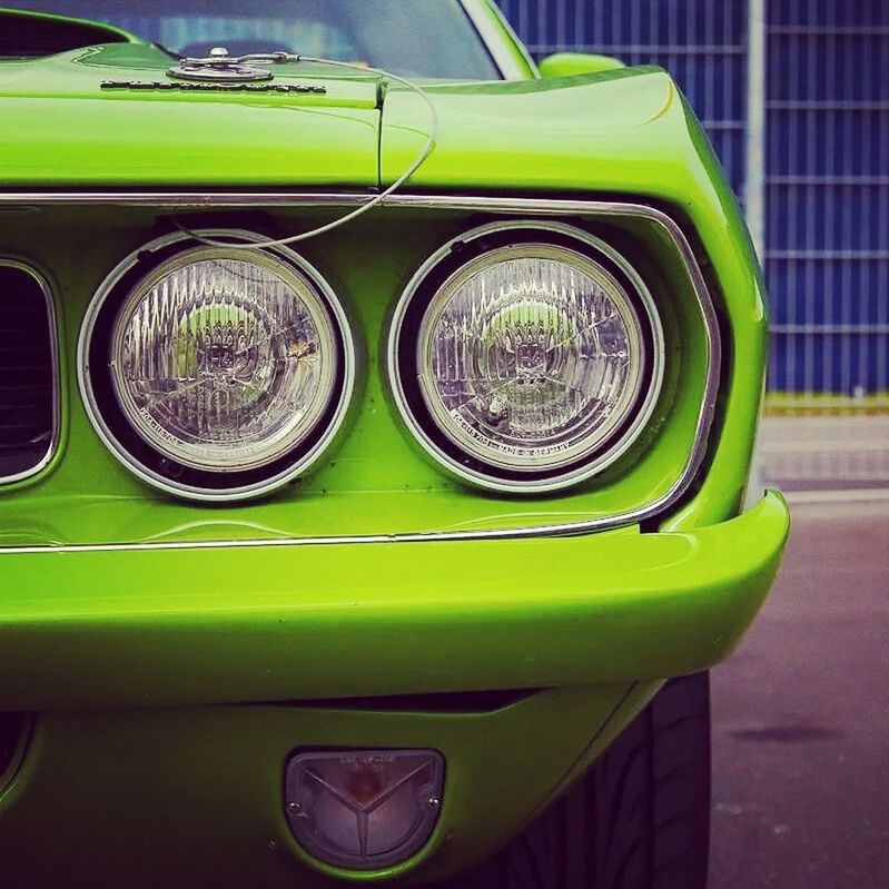 transportation, mode of transport, car, land vehicle, vehicle interior, stationary, vintage car, headlight, reflection, travel, close-up, glass - material, no people, part of, street, day, green color, window, vehicle seat, parking