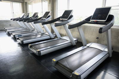 Empty chairs and tables in room