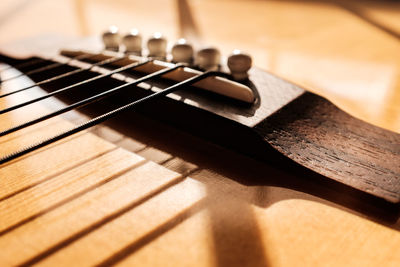 Close-up of guitar on table