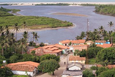 High angle view of river by buildings in city