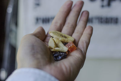Close-up of hand holding food
