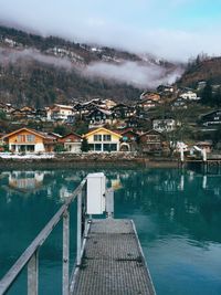 Lake with built structures in the background