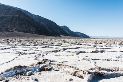 Scenic view of mountains against clear blue sky