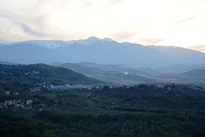 Scenic view of landscape and mountains against sky