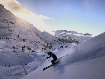 Man skiing on snowcapped mountain