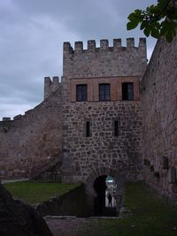 Old building against cloudy sky